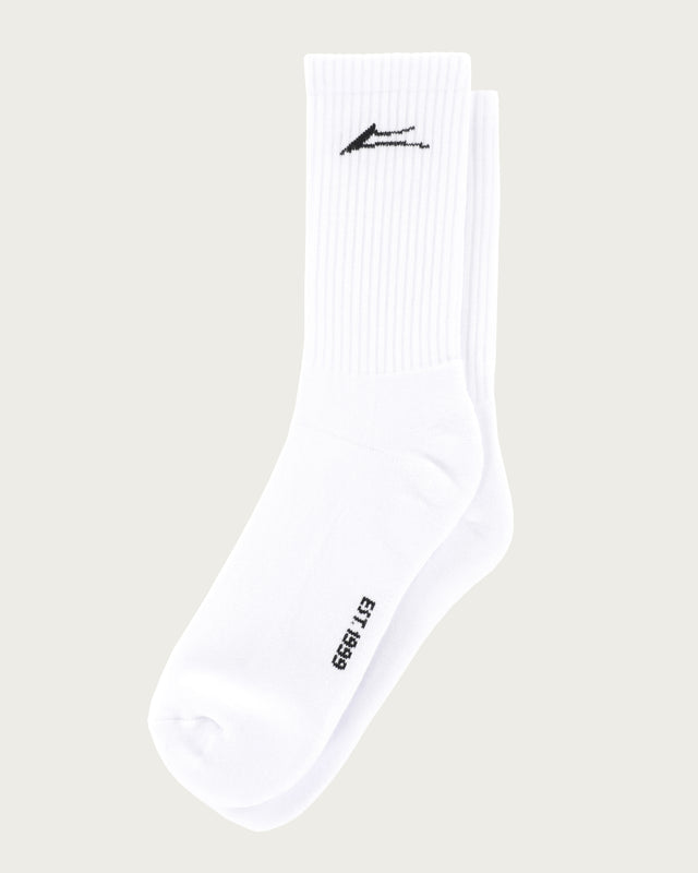 White sock with black logo and text on a beige background
